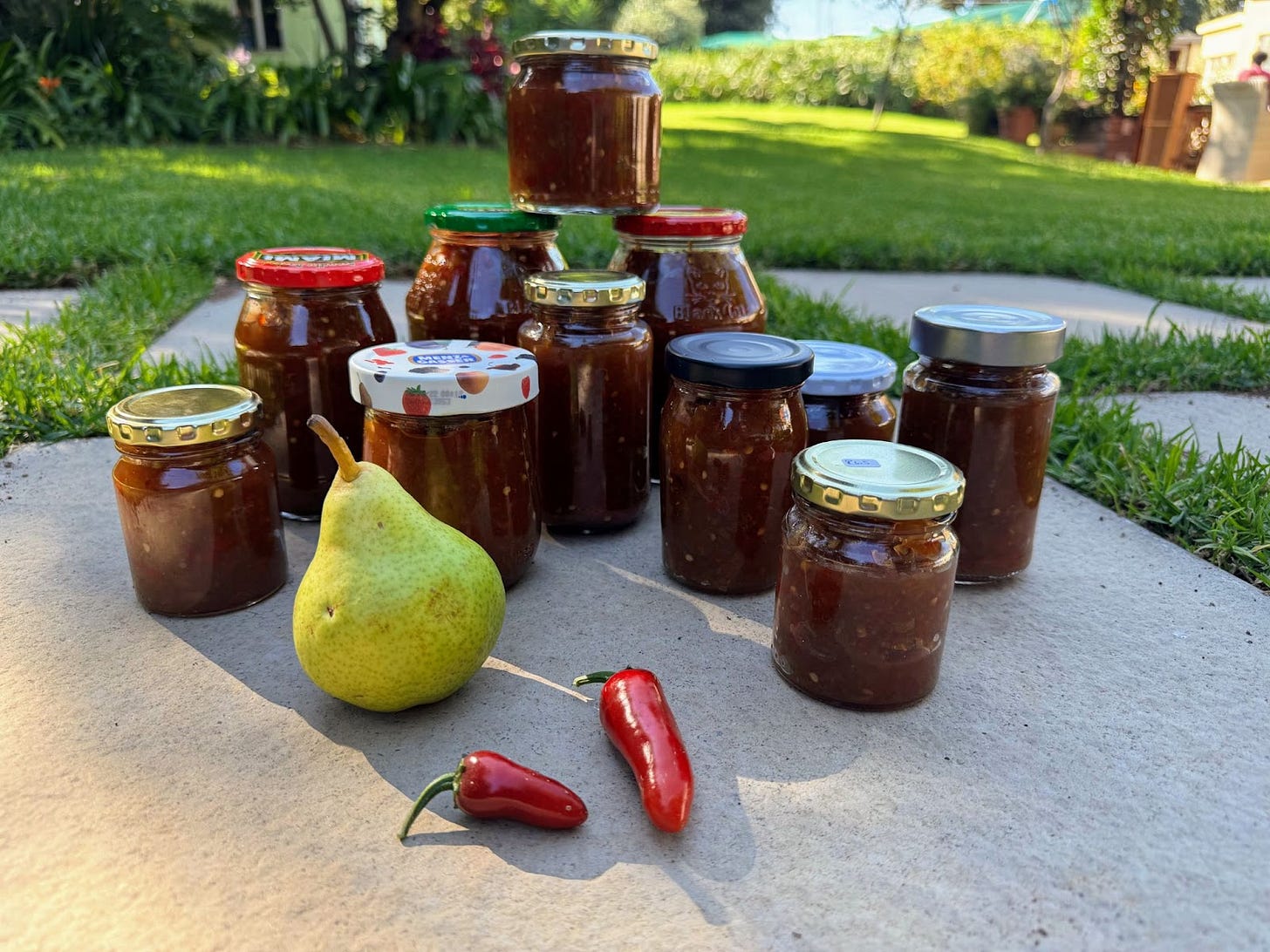 …to this. Jars and jars of our “Ember Kiss” jam. It starts with a luscious, fruity sweetness from apples and pears, gently unfolding into the rich warmth of cloves, nutmeg, and cin