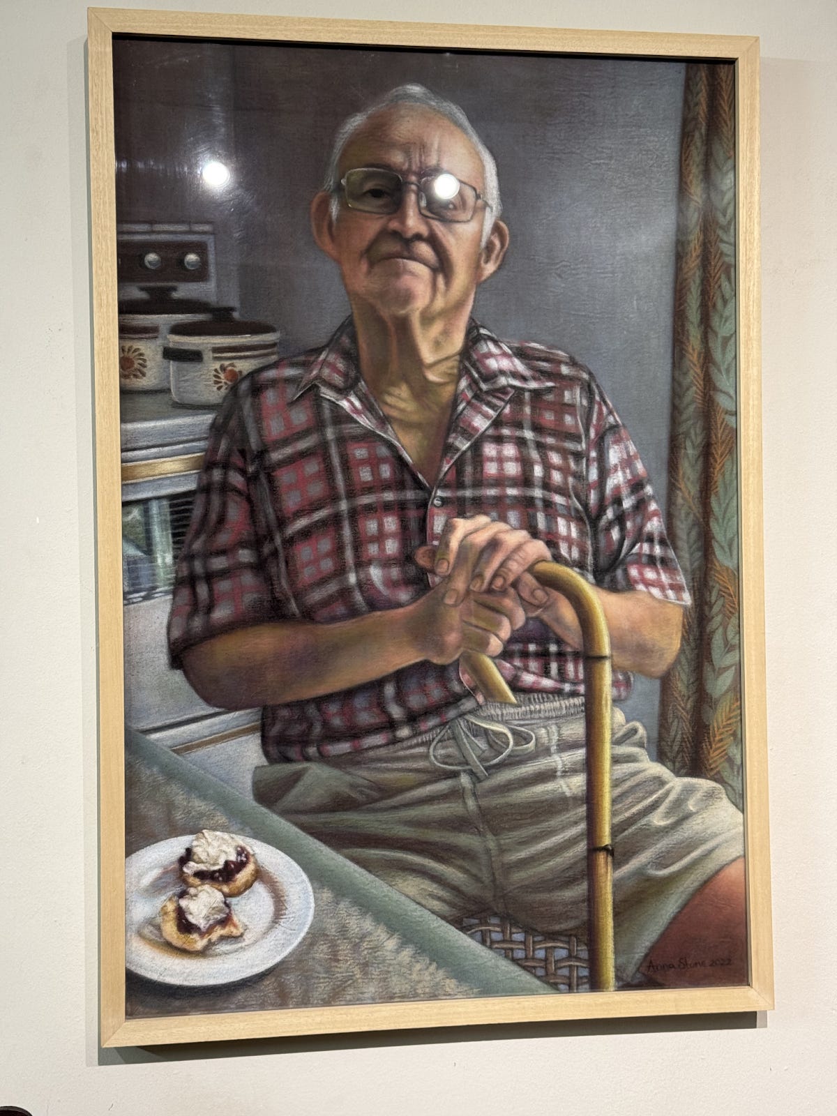 Hands folded, cane resting, scones waiting.Every crease and crumb rendered with tender precision by Anna Stone. 🎨🪑