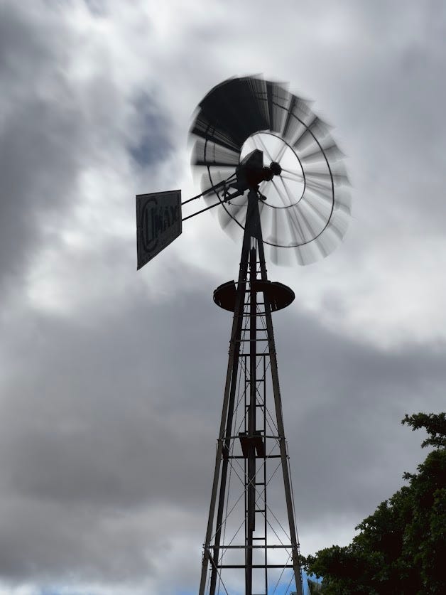 Spinning in silence beneath Karoo skies, the old windmill sings to the wind that raised it. 🌬️🌾
